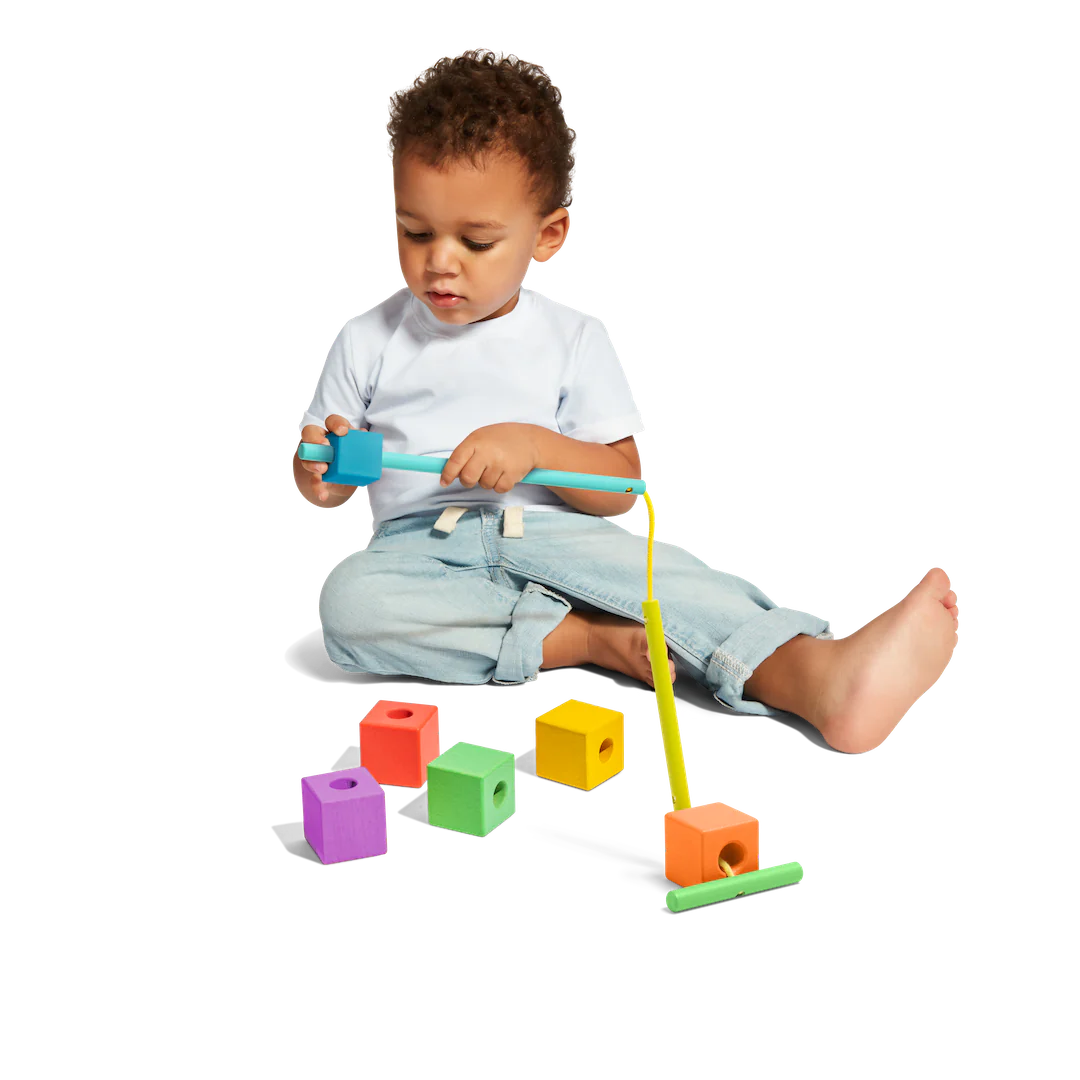 Explore connections and pattern play by threading blocks of different colours.